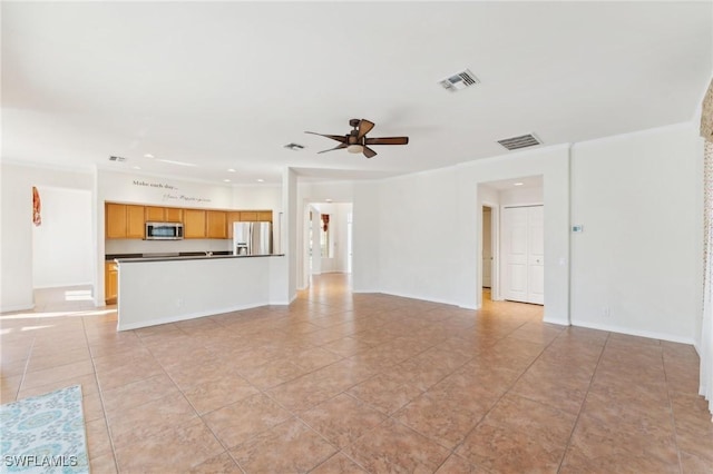 unfurnished living room featuring baseboards, light tile patterned floors, visible vents, and a ceiling fan