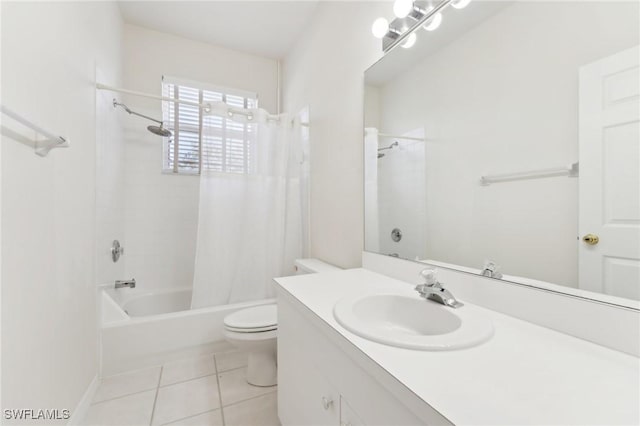 bathroom featuring toilet, vanity, shower / tub combo with curtain, and tile patterned floors