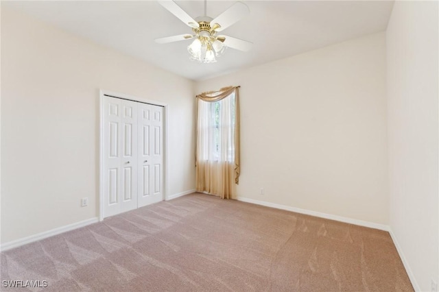 unfurnished bedroom featuring a closet, carpet flooring, and baseboards