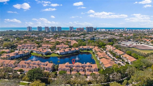 birds eye view of property featuring a water view and a residential view