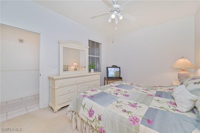 bedroom with ceiling fan and light colored carpet