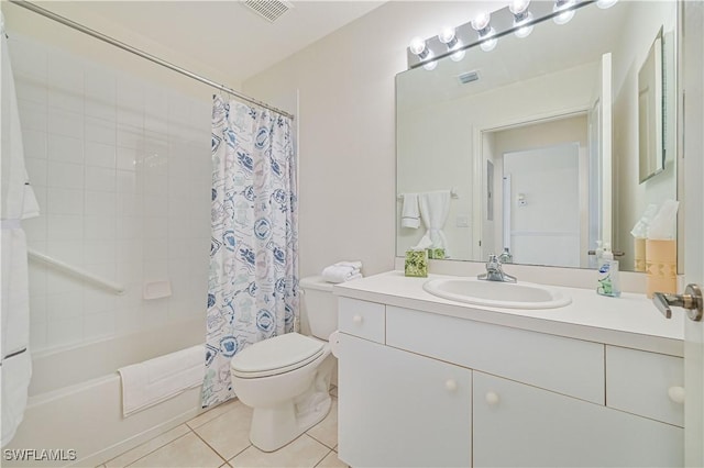 bathroom with toilet, tile patterned flooring, visible vents, and vanity