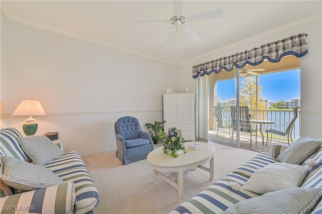 carpeted living room featuring a ceiling fan and crown molding