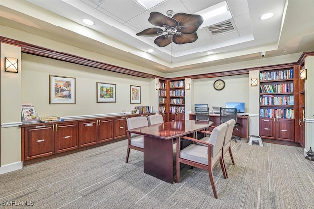 dining room featuring visible vents, a raised ceiling, light colored carpet, ceiling fan, and recessed lighting