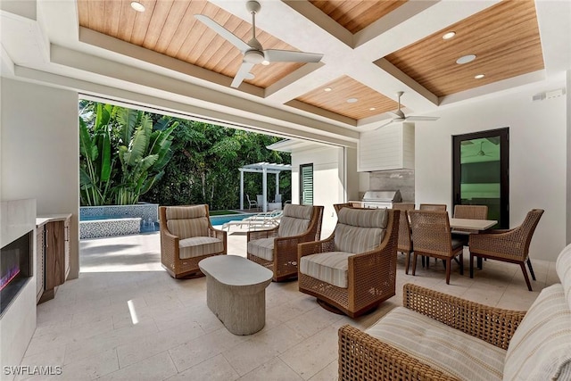 interior space with outdoor dining area, area for grilling, an outdoor living space, and a ceiling fan