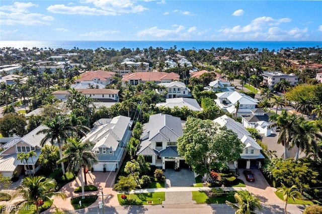 bird's eye view with a residential view and a water view