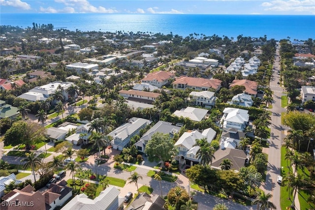 bird's eye view featuring a water view and a residential view