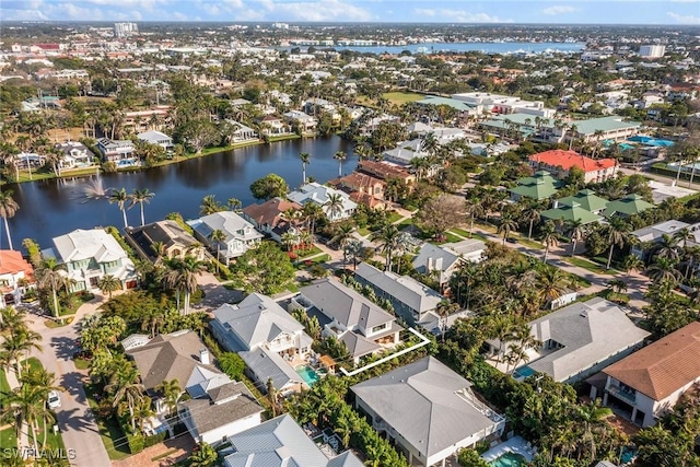 birds eye view of property with a residential view and a water view