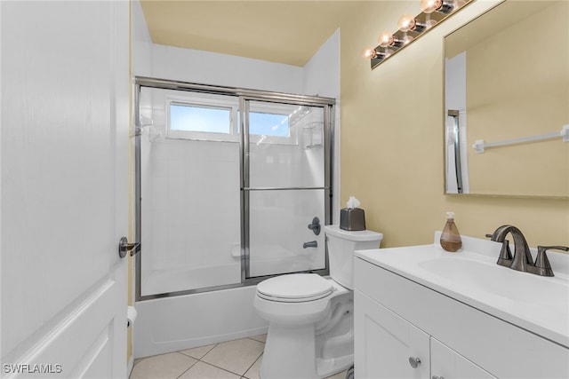 full bathroom featuring toilet, tile patterned flooring, combined bath / shower with glass door, and vanity