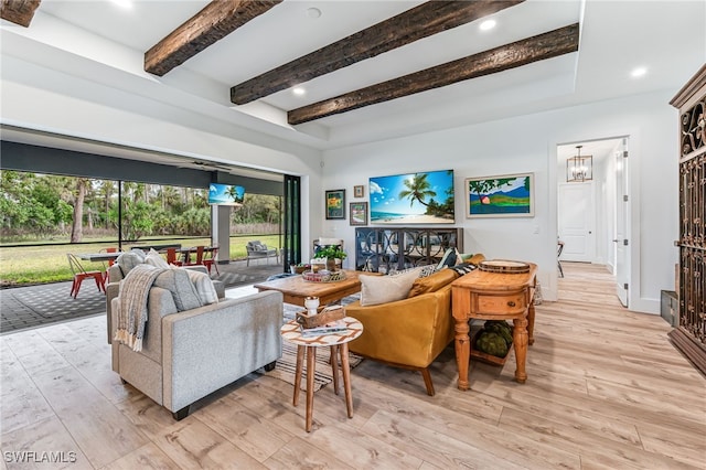 living room featuring baseboards, light wood finished floors, beamed ceiling, and recessed lighting