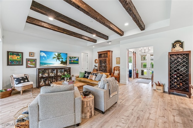 living room with beam ceiling, french doors, recessed lighting, light wood-style flooring, and a chandelier