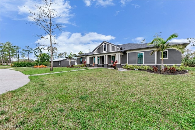 craftsman-style house with board and batten siding and a front yard