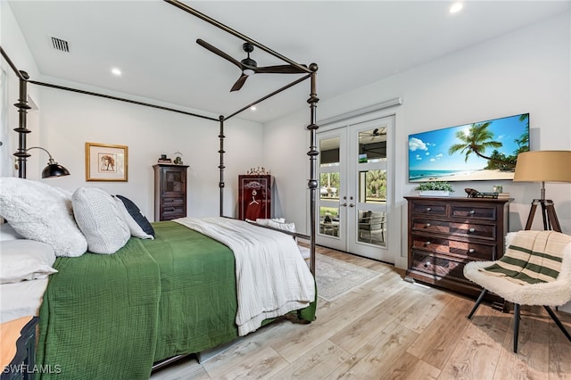 bedroom featuring ceiling fan, wood finished floors, visible vents, access to exterior, and french doors