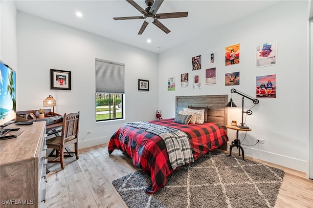 bedroom with light wood-style floors, baseboards, a ceiling fan, and recessed lighting