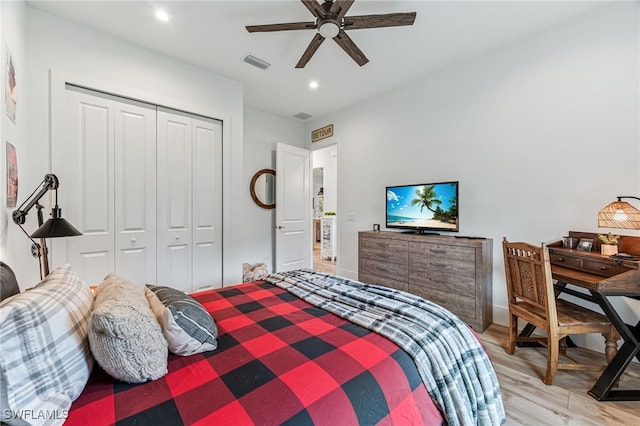 bedroom with light wood-style flooring, a closet, visible vents, and recessed lighting