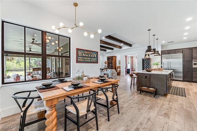 dining room featuring light wood-style floors, recessed lighting, beamed ceiling, and baseboards