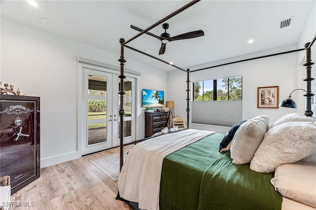 bedroom featuring light wood finished floors, visible vents, baseboards, ceiling fan, and access to exterior