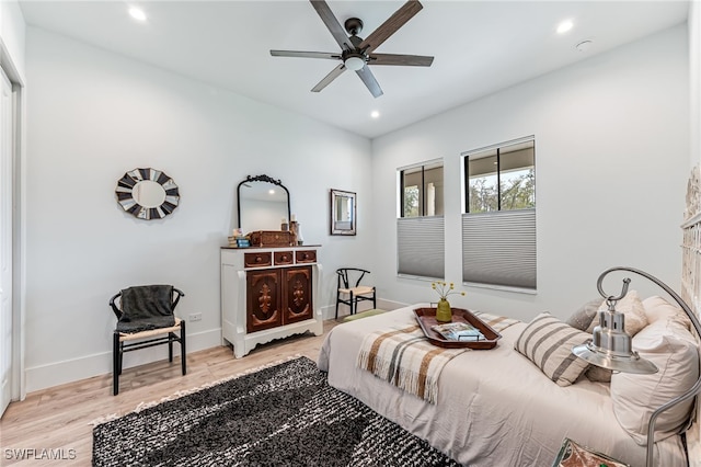 bedroom featuring baseboards, a ceiling fan, light wood-style flooring, and recessed lighting