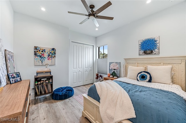 bedroom featuring a ceiling fan, recessed lighting, a closet, and light wood-style flooring