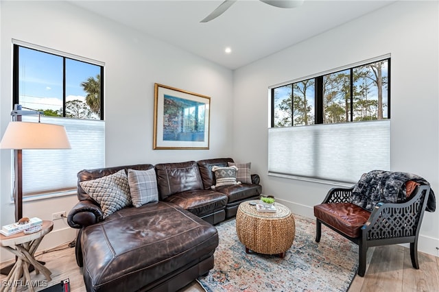 living room with recessed lighting, wood finished floors, a ceiling fan, and baseboards