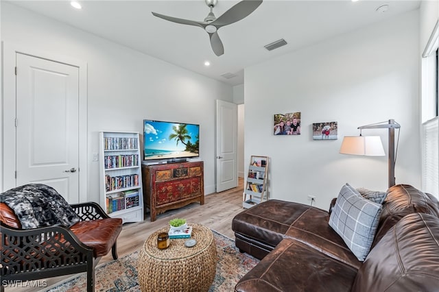 living area with ceiling fan, wood finished floors, visible vents, and recessed lighting