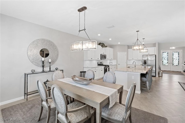 dining area featuring light tile patterned floors, recessed lighting, baseboards, and french doors