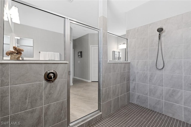 full bathroom with a tile shower