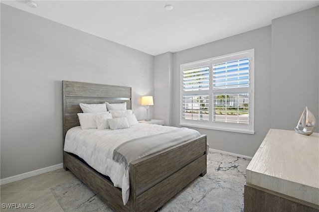 bedroom featuring baseboards