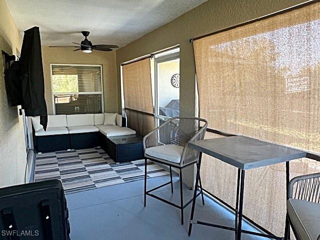 view of patio featuring a ceiling fan and outdoor lounge area