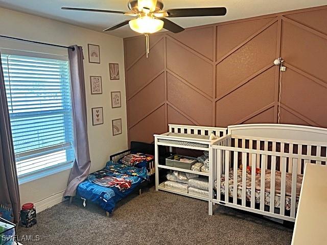 bedroom featuring carpet and a ceiling fan