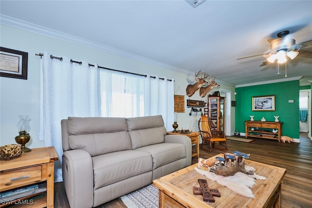 living room featuring ceiling fan, ornamental molding, and dark wood-style flooring