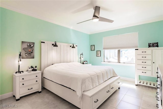 bedroom featuring light tile patterned floors, baseboards, ornamental molding, and ceiling fan