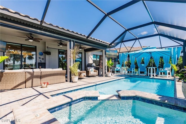 view of swimming pool with an outdoor hangout area, a patio area, a lanai, and a pool with connected hot tub