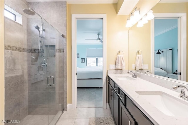 bathroom featuring ornamental molding, a stall shower, a sink, and ensuite bathroom