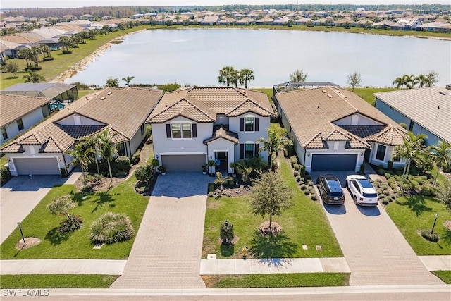 aerial view with a water view and a residential view