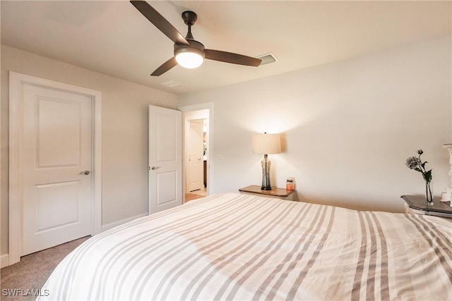 bedroom featuring visible vents, ceiling fan, and carpet flooring