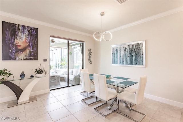 dining room with ornamental molding, baseboards, and light tile patterned floors