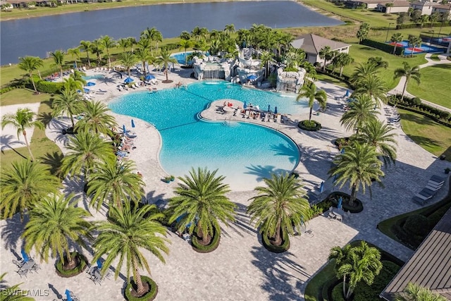 community pool with a patio and a water view