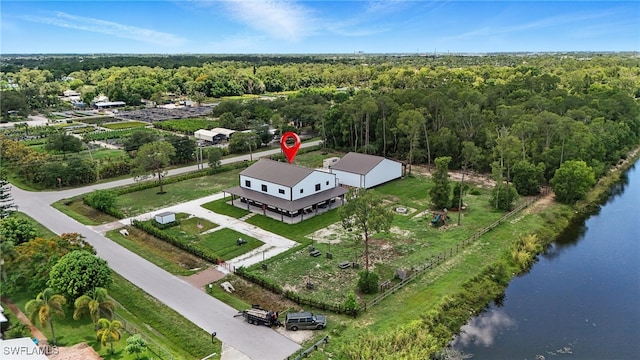 1474 Saint Clair Shores Rd, Naples, FL 34104 - drone / aerial view of a large body of water and a heavily wooded area