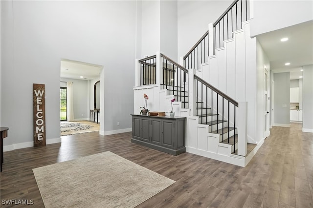 1474 Saint Clair Shores Rd, Naples, FL 34104 - stairs with a towering ceiling, wood finished floors, and recessed lighting