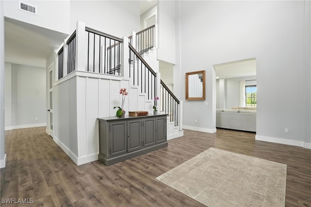 1474 Saint Clair Shores Rd, Naples, FL 34104 - foyer featuring a towering ceiling, dark wood-style flooring, and stairs