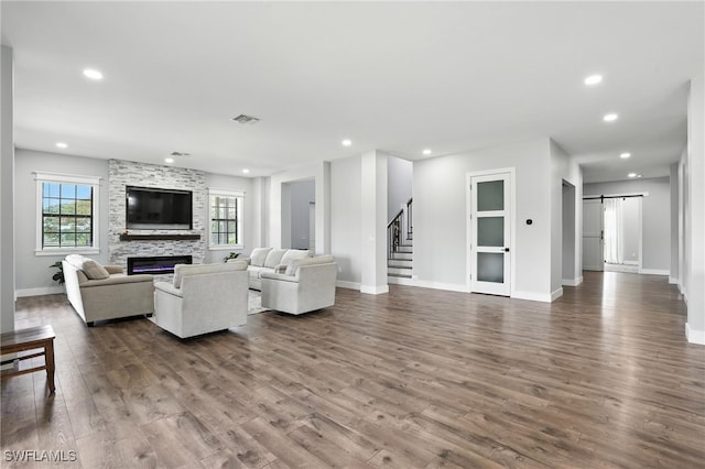 1474 Saint Clair Shores Rd, Naples, FL 34104 - living area featuring a barn door, dark wood-type flooring, healthy amount of natural light, stairs, and recessed lighting