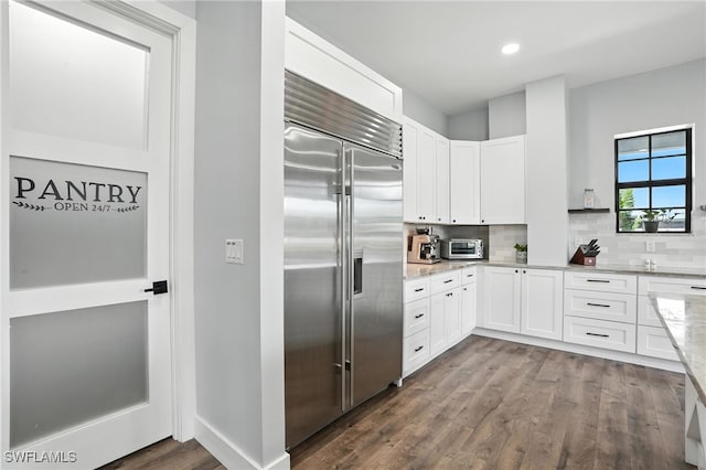 1474 Saint Clair Shores Rd, Naples, FL 34104 - kitchen featuring stainless steel built in refrigerator, light stone countertops, tasteful backsplash, dark wood finished floors, and recessed lighting