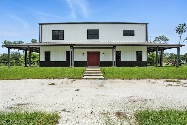 1474 Saint Clair Shores Rd, Naples, FL 34104 - view of front of property featuring a metal roof