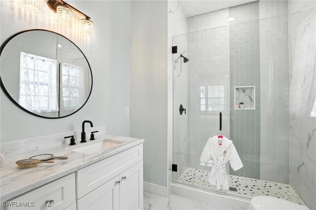 1474 Saint Clair Shores Rd, Naples, FL 34104 - bathroom with marble look tile flooring, vanity, and a stall shower