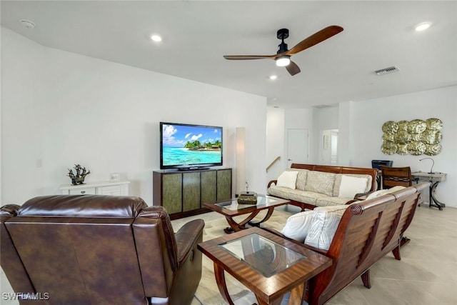 living room featuring light tile patterned floors, ceiling fan, visible vents, and recessed lighting