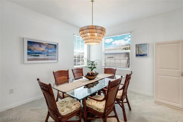 dining area featuring baseboards