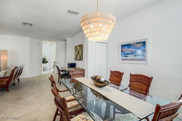 dining area with a chandelier and visible vents