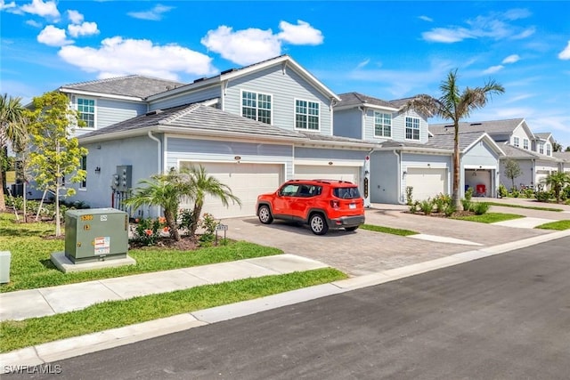 view of front of property with decorative driveway