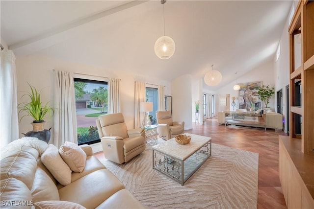 living area with high vaulted ceiling